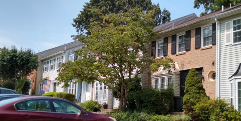 Cars parked near Glen Cove HOA homes